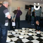 Giant draughts at an indoor office event