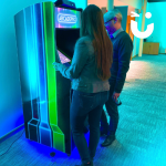 Two people playing games on the Arcade Machine