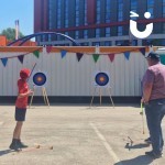 Soft Target Archery Hire Set up outdoors at a family fun day with a father and son taking aim