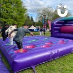 Assault Course Inflatable Pot Holes Hire Outside at a student event 