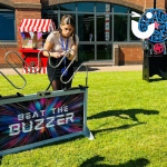 Guest at a Corporate Event playing the Mega Buzz Wire outdoors