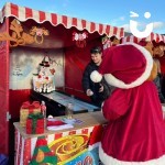 Penguin Skittles Alley Stall at a festive market With Santa Bear