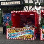 Christmas Snowball Target Stall set up outside at a day time community event next to our star maze runner