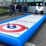 Curling Lane set up on an office carpark being enjoyed by colleagues