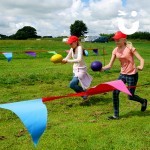 Two girls racing each other with egg and spoon hire our 