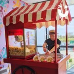 Candy Floss and Popcorn being freshly made on the same cart at a corporate event being staffed my a fun expert