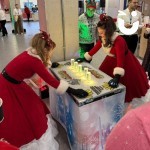 Icicle Grab it for Christmas being enjoyed by 2 ladies in Santa Dresses