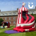 Inflatable Helter Skelter Slide At A Community Fun Day