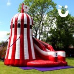 Our Helter Skelter Slide Hire set up in the sun for a family fun day outdoors