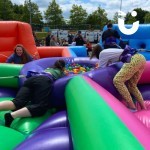 Hungry Hippos Inflatable Hire at outdoor family fun day with 4 competitors having fun!