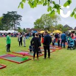 Mini Golf Hire at a Family Fun Day being enjoyed by people of all ages