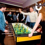 Group of guests about to kick off a game with the Party Football Hire