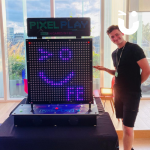 Fun Expert posing with Pixel Play displaying our winking face