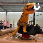 Rodeo Bull Hire at a filming event with a man dressed as a dinosaur