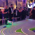 Scalextric Track Hire with people in black tie dress competing