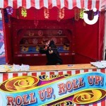 Funfair Target Stall With An Excited Fun Expert