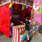 Hook a Duck Side Stall with novelty prizes at a fun day being used by a little boy