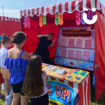 People having a go at the Play Your Cards Right Stall