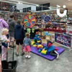 Spin the Wheel set up alongside other fun equipment in a supermarket for a promotional event