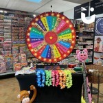 Spin the wheel indoors surrounded by prizes