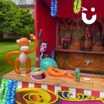 Tin Can Alley Stall With Prizes At A Family Fun Day