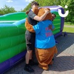 Fun Bear Hire giving 2 Fun Experts a big hug