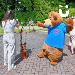 Fun Bear Hire having a go at Archery at a corporate fun day