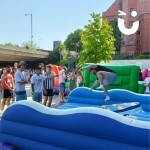 Surf Simulator Hire at a student event with a large group of happy students