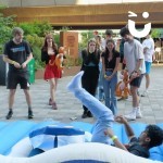 Surf Simulator Hire at a student event with a laughing group of students