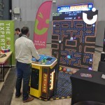 World's largest Pacman at an exhibition with a man giving it a go!