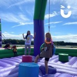 Inflatable Wrecking Ball Hire at a freshers welcome week with students smiling at the camera