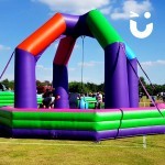 Inflatable Wrecking Ball providing fun for guests of an outdoor family fun day event, on hire from Sunshine Events.